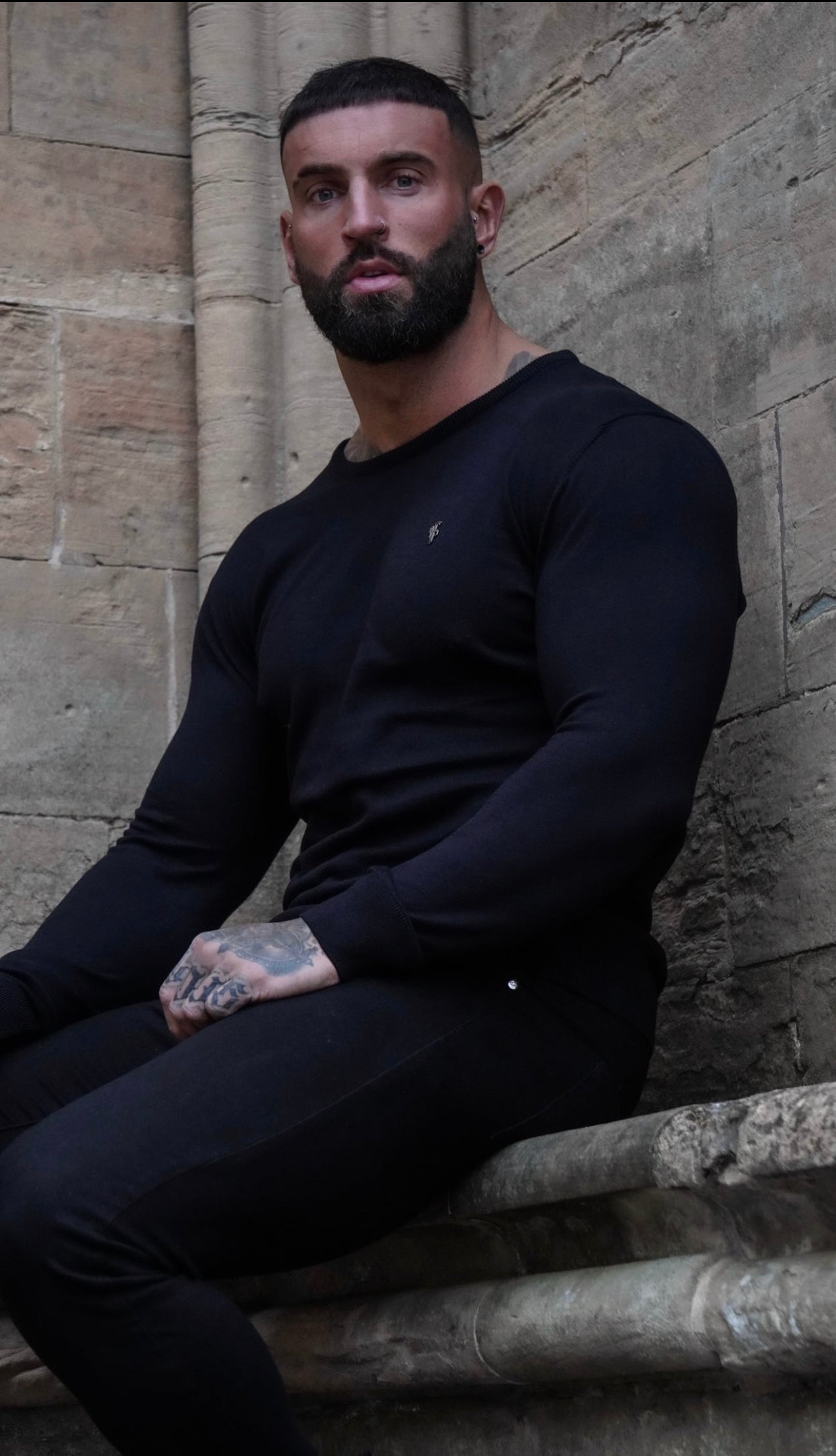 Classic Black Crew Neck Knitted Jumper with Metal Decal - FSN086